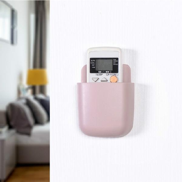 Wall-mounted phone holder. Wall-mounted phone holder.